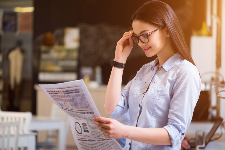 woman reading newspaper